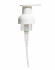 White pump dispenser replacement part on a white background