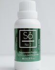 White bottle with a shimmery green label labeled Só No. 2 Peppermint Patties Toilet Drops on a white background