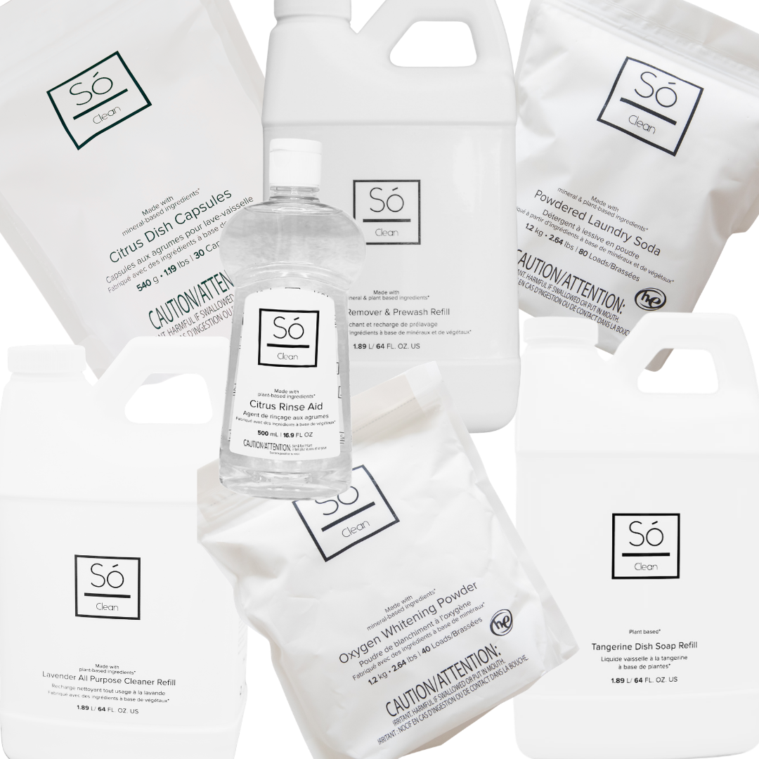 A set of Só Clean laundry and bathroom cleaning products on a white background, including a clear bottle of Citrus Rinse Aid, white refill jugs of Tangerine Dish Soap, Lavender All Purpose Cleaner and Stain Remover and Prewash and white bags of powdered laundry soda, citrus dish capsules and oxygen whitening powder.
