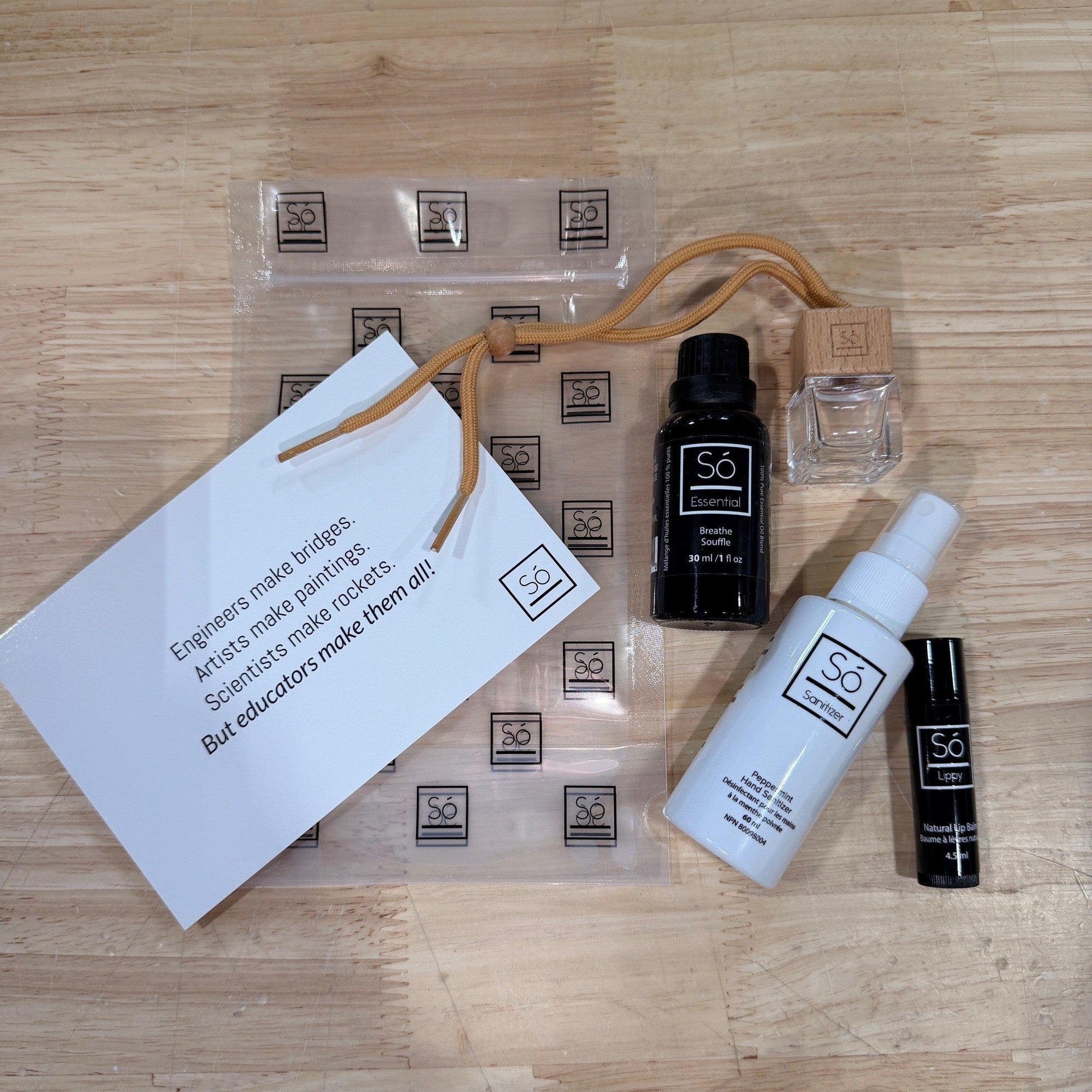 Teacher Gift Bundle on Wood Surface with Essential Oil Diffuser Lip Balm and Hand Sanitizer
